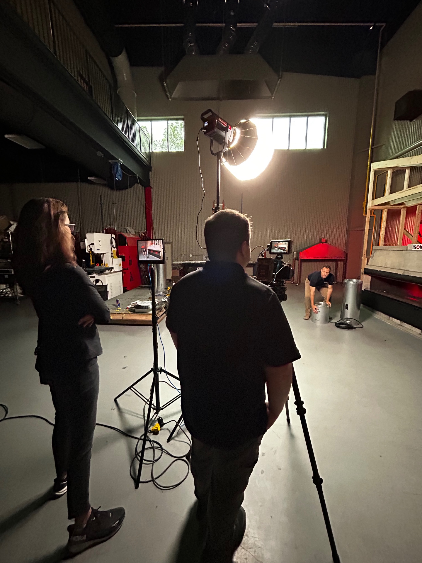 Video crew filming an on-location product shoot in a Virginia manufacturing facility